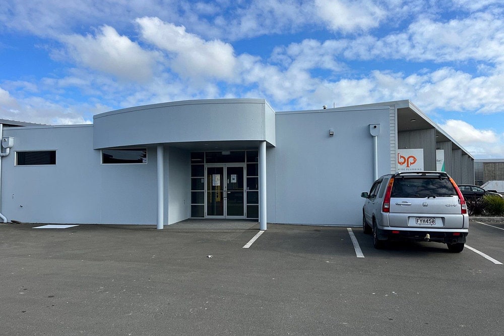 Onekawa Trade Depot with a car parked in front of it.